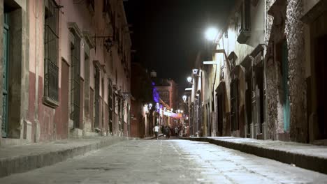 far away, people walking in the streets of san miguel de allende