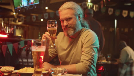 handsome mature man in pub