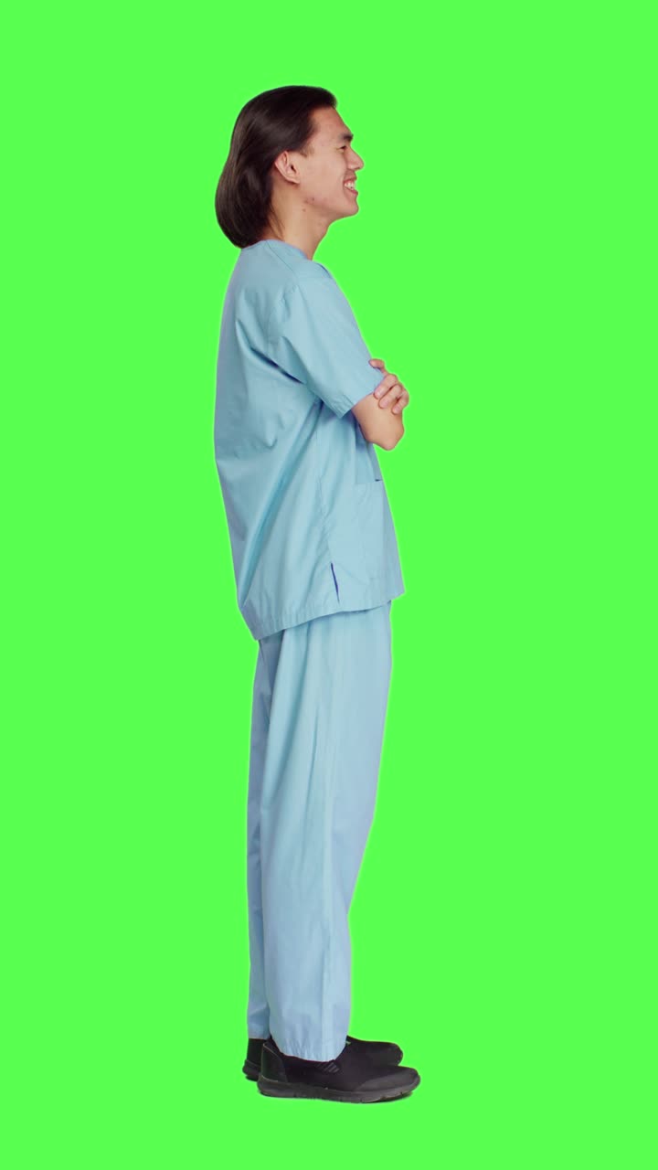 Profile of joyful specialist standing in studio