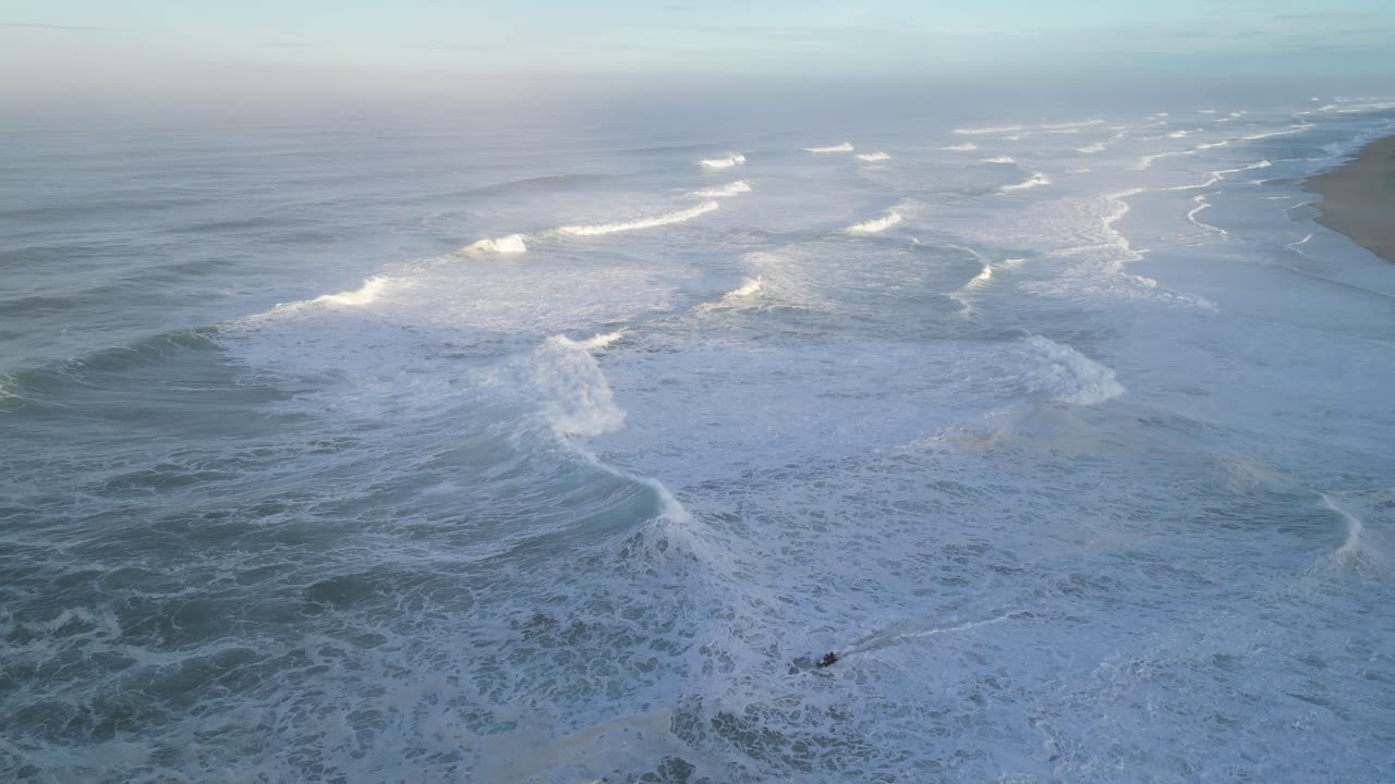 Waves crashing along the coast of Farol, Nazaré, Portugal in early morning light