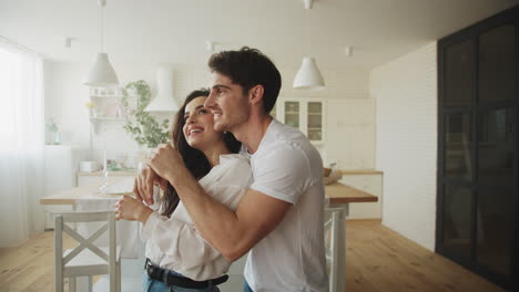 Portrait-of-happy-couple-planning-interior-design-in-slow-motion.