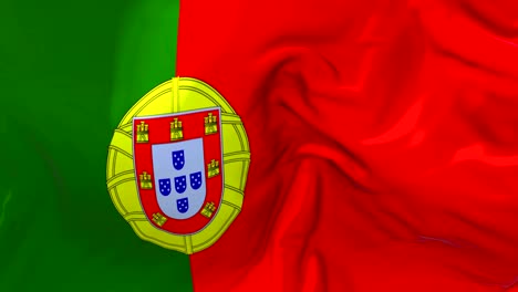 portugal flag waving in wind slow motion animation . 4k realistic fabric texture flag smooth blowing on a windy day continuous seamless loop background.