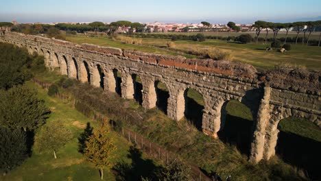 beautiful aerial drone view of claudio aqueduct in rome, italy