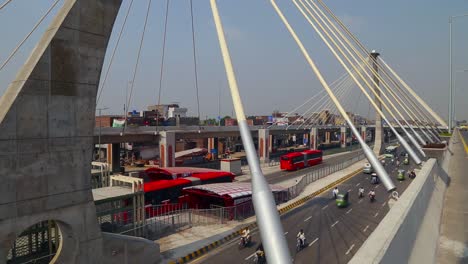 Modern-flyover-Traffic-junction-with-red-metro-buses-passing's