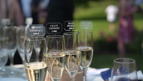 glasses filled with champions' celebratory drinks, set against the backdrop of a lively gathering