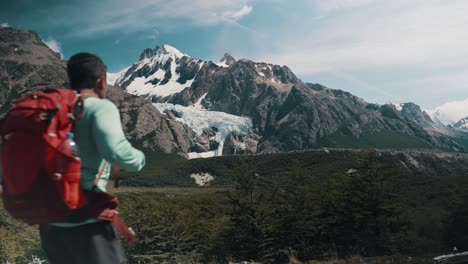 man hiking towards mt