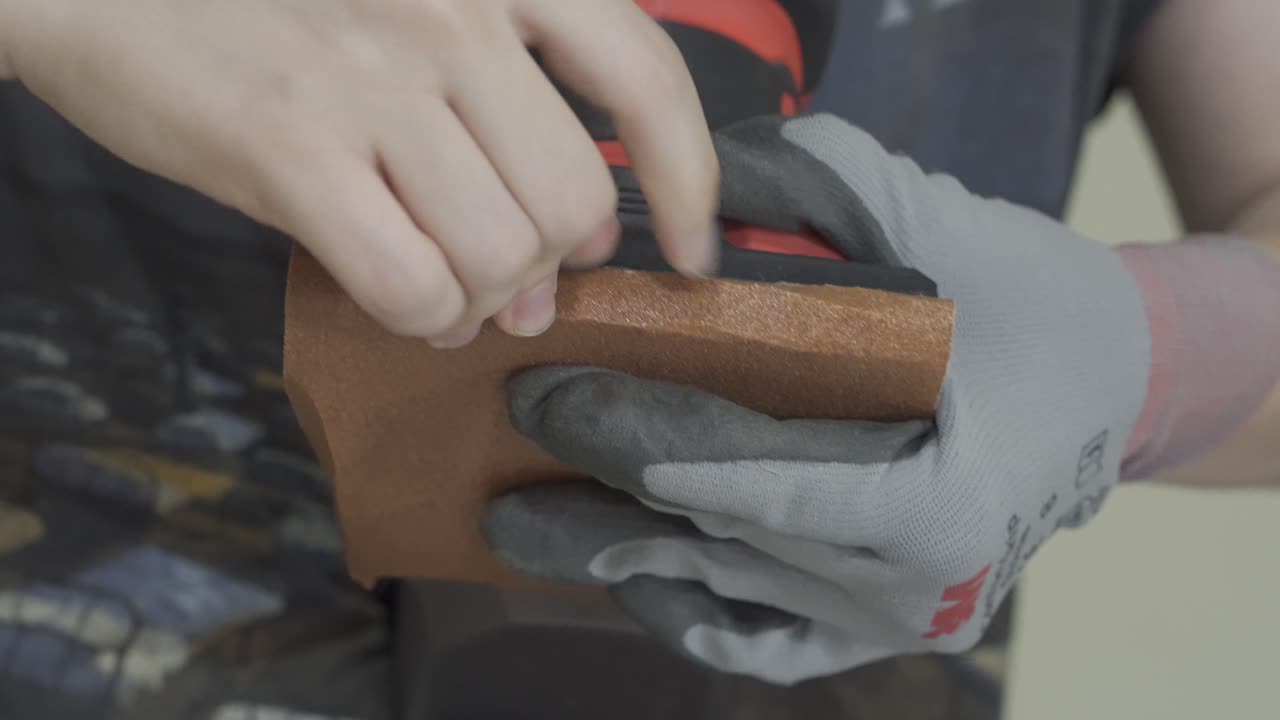 Sand Paper Being Placed On Machine