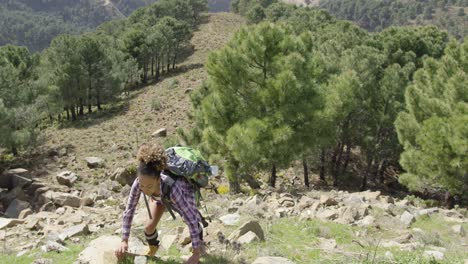 fit girl climbing hill