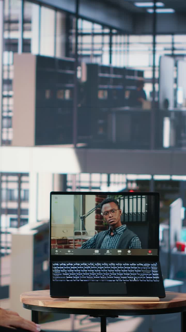 Vertical Video Multicultural group interacting in a corporate video call in a boardroom