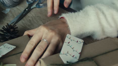 person wrapping christmas presents