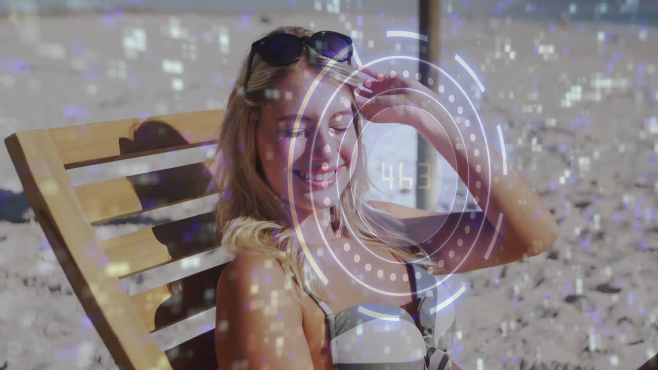 Woman relaxing on beach with digital interface animation overlaying her