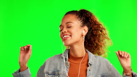 Woman,-dancing-and-listening-to-music-on-green