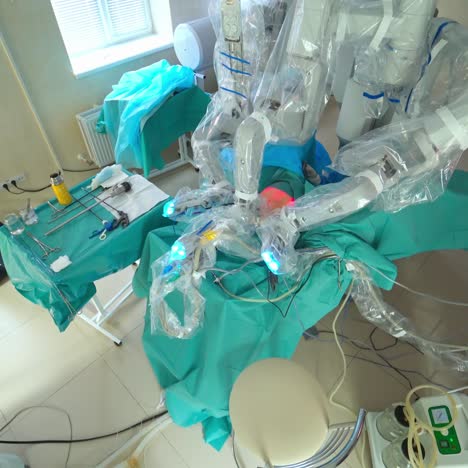 doctors using surgery robot. team of surgeons works with patient monitoring in surgical operating room