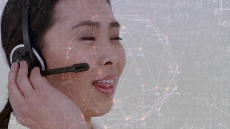 Animation-of-networks-of-connections-over-businesswoman-wearing-phone-headset