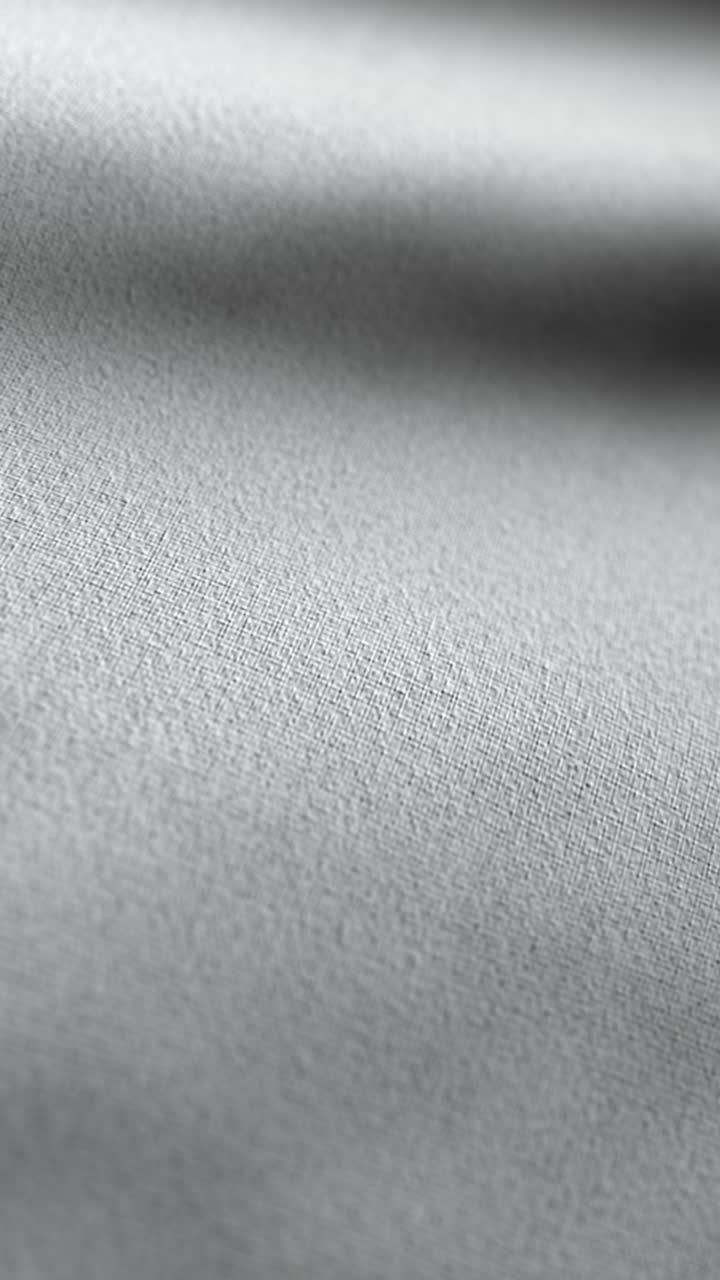 Superficie tessile macro con sottile motivo a onde animato