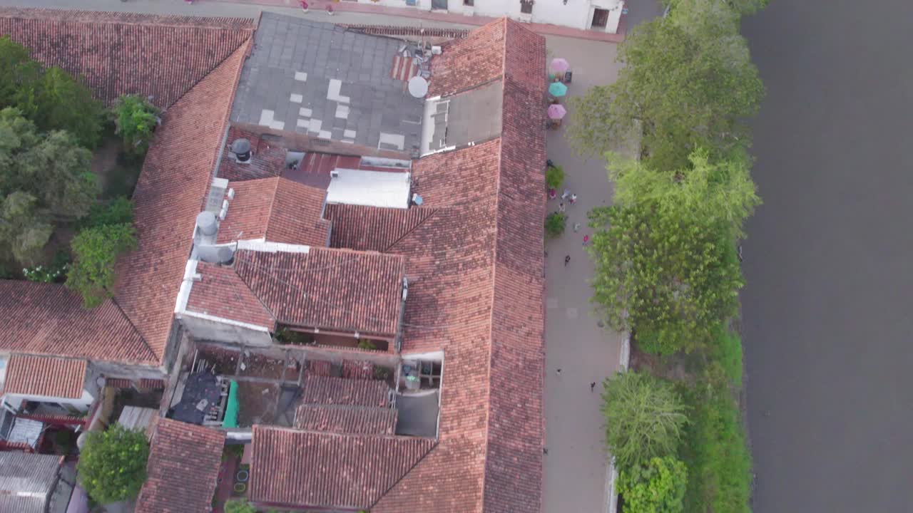 The malecon and the Magdalena river. This majestic river has shaped the town’s history and culture. Pitch forward zenith shot.