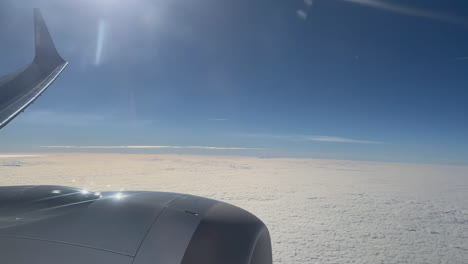 high-altitude flight above fluffy clouds