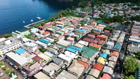aerial view of a vibrant coastal town with colorful houses and bay