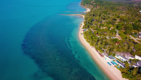 4k aerial front view of surin beach, phuket