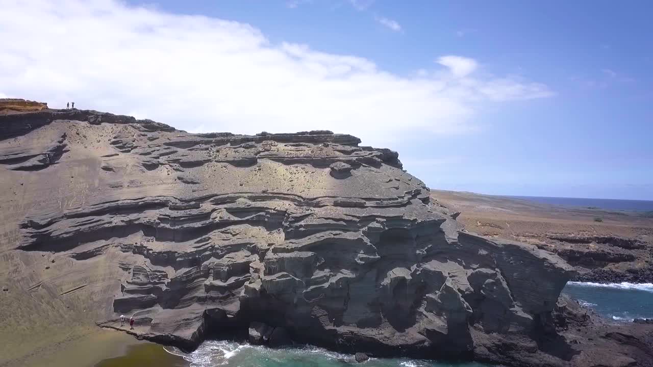 Beautiful Green Sand Beach on the Big Island in Hawaii at the most southern tip in the United States shot with a drone in slow motion.