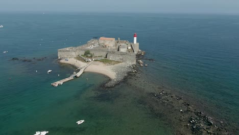 aerial panorama of an old sea fort with a lighthouse on the small island