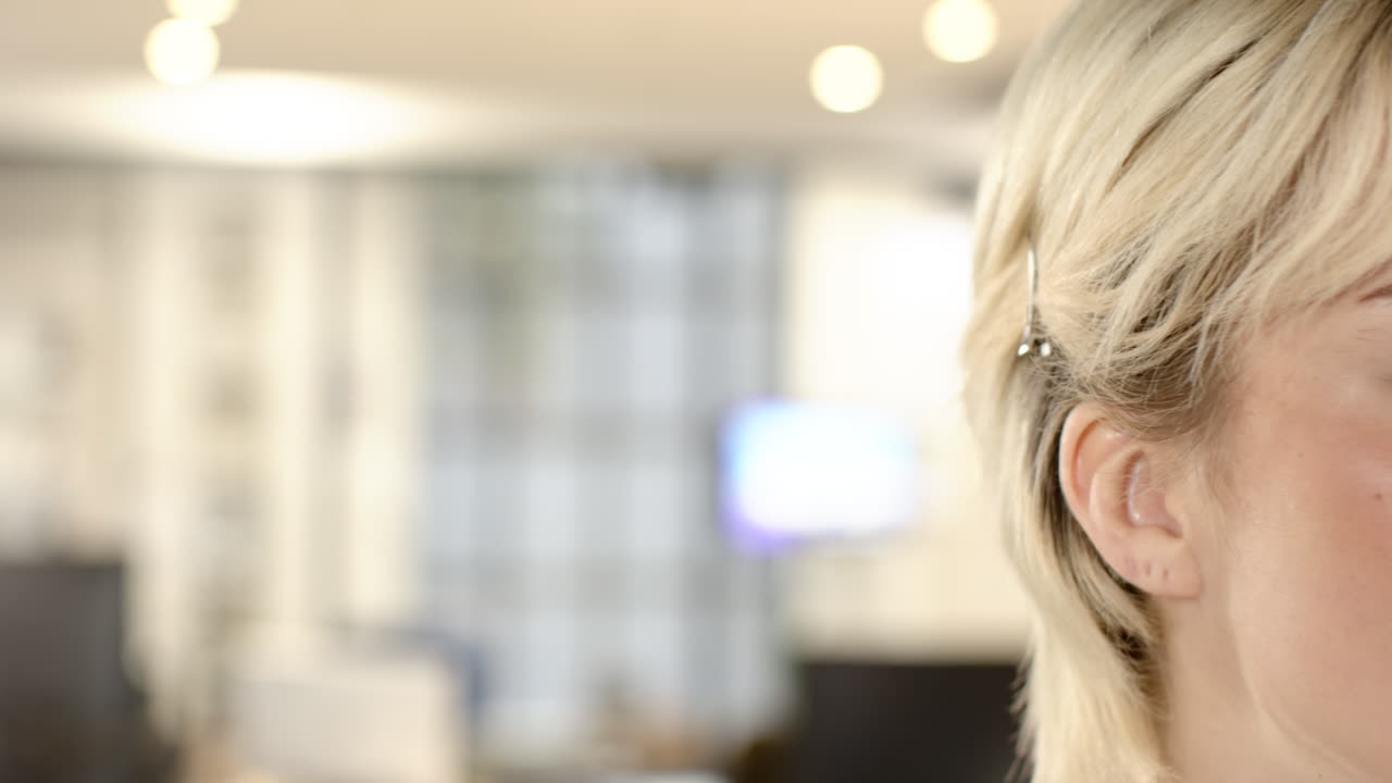 Working in creative writing business, woman focusing on her task in office