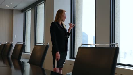 businesswoman talking on mobile phone in office 4k