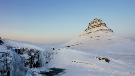 beautifull kirkjufell in winter iceland with kirkjufellfoss as a foreground