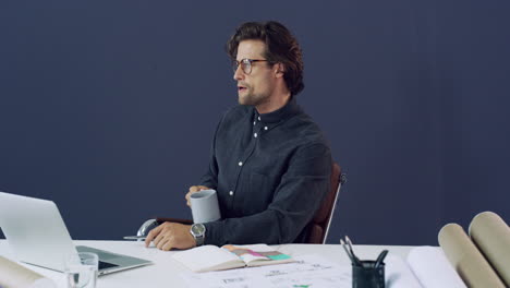 a-handsome-young-male-architect-drinking-coffee