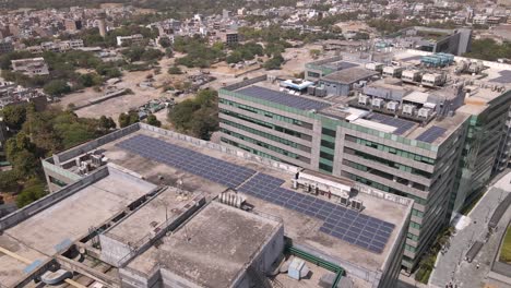 sweeping drone shots of a sleek business park in gurgaon, haryana—glass skyscrapers, landscaped greenery, and urban infrastructure reflecting india’s growing global corporate presence