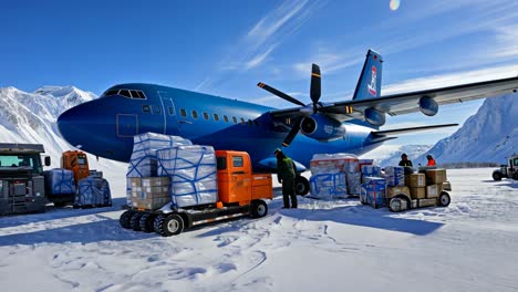 aircraft delivers cargo in snowy landscape of antarctica during daytime