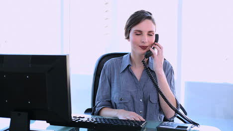 pretty businesswoman answering phone