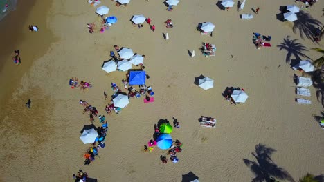 Droning-above-a-busy-Isla-Verde-Beach-in-Puerto-Rico