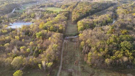 power lines in midwest, us countryside landscape, aerial