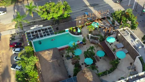 rooftop pool bar at mayan monkey hotel in tulum mexico, aerial top down view