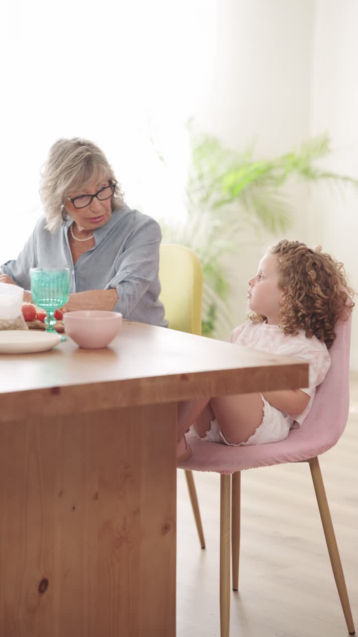 Grandmother and Granddaughter at the Table