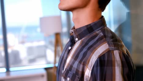 smiling man standing in the office