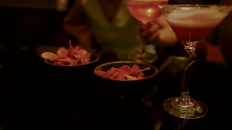 enjoying drinks and snacks in a bar