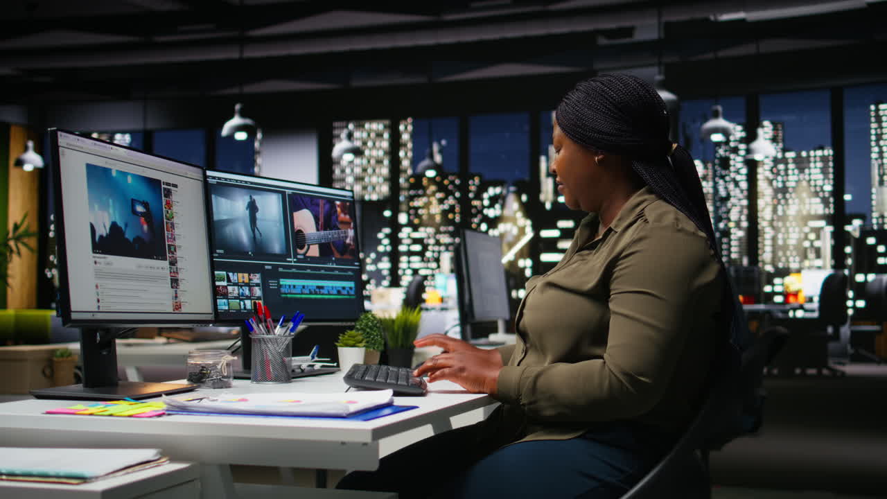 African american female videographer editing a film montage project