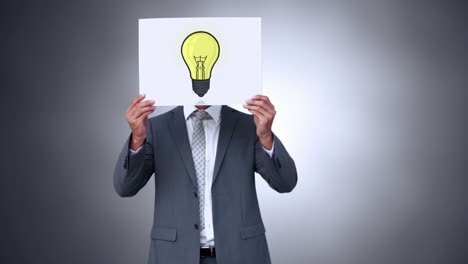 Businessman-holding-light-bulb-animation-over-face