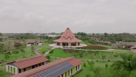 aerial footage moving towards the baha’i house of worship in cali, colombia