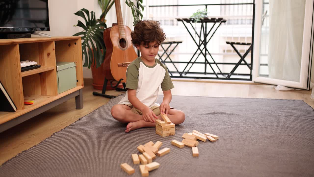Young child playing with wooden blocks on a carpet