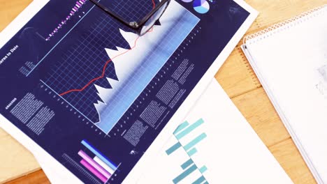 man hand preparing a graph chart on notepad