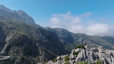 Flyover-of-rock-formation-scenery-and-the-winding-road-of-Sa-Calobra