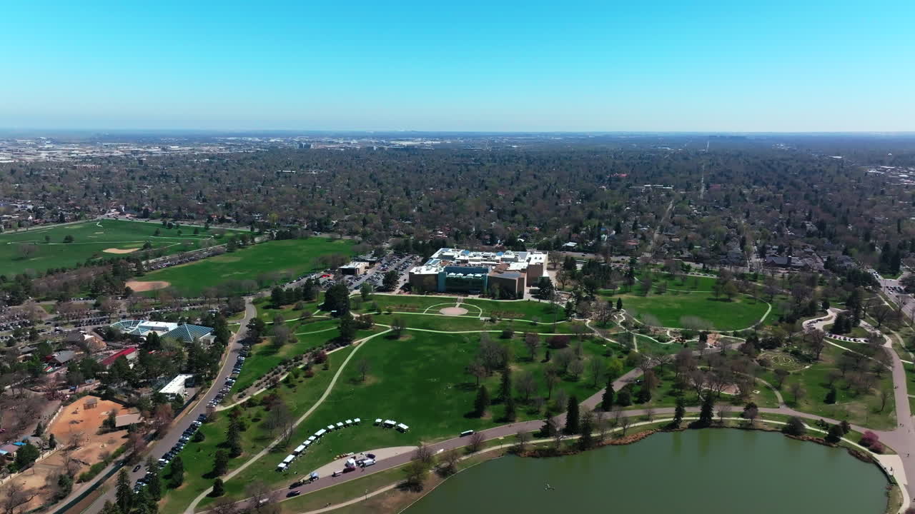 The Denver Museum of Nature and Science building city living Ferril Duck Lake City Park Pavilion Golf Course Downtown Denver Cityscape Colorado aerial drone spring summer forward motion