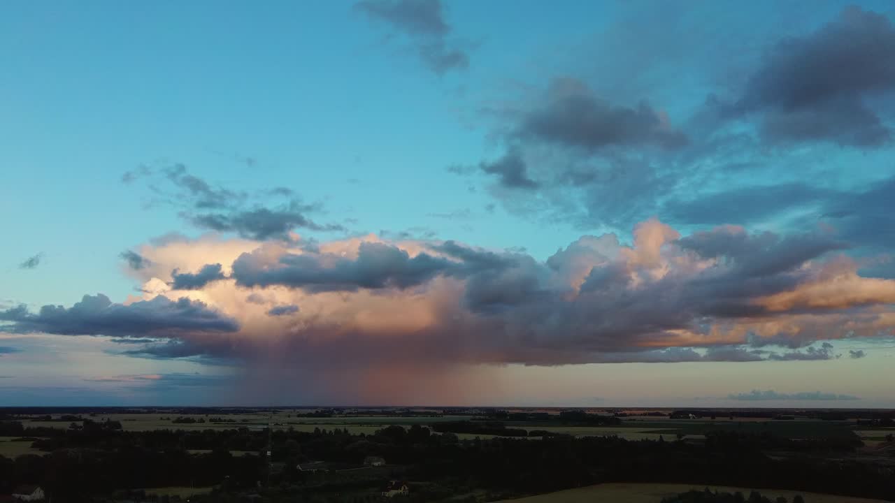 Storm Clouds With the Rain. Nature Environment Tornado Warned Supercell Storm Rolling Through the Plains. Crop Field After Rain and Storm Clouds in Background Rural Countryside. Aerial Dron Shot