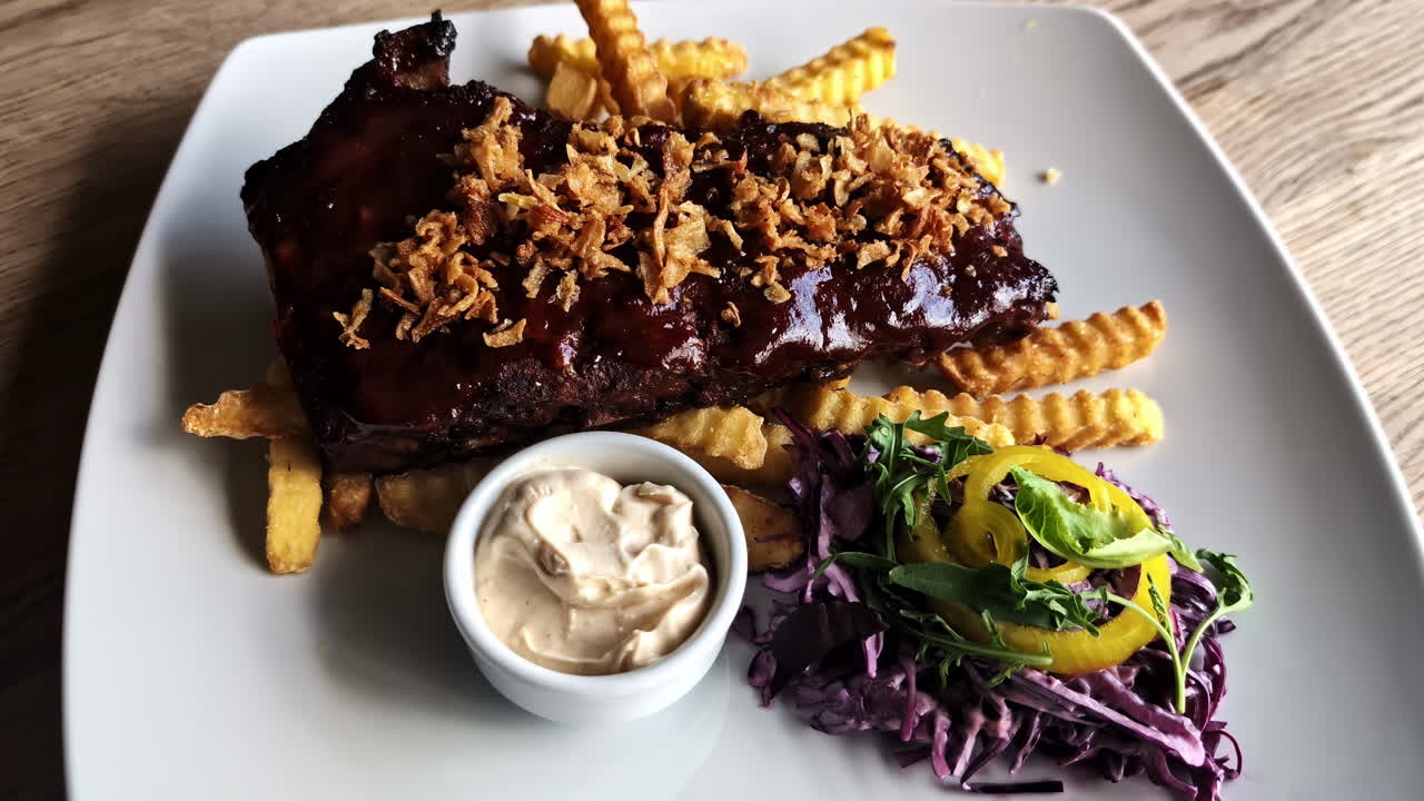 BBQ prime ribs sauce caramelised onions side salad radish sauce american dish cuisine