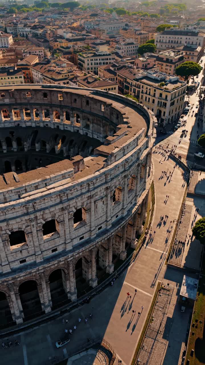 Aerial video captures the ancient Colosseum in Rome at sunset, showcasing its grandeur