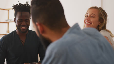 group of friends looking and smiling at each other