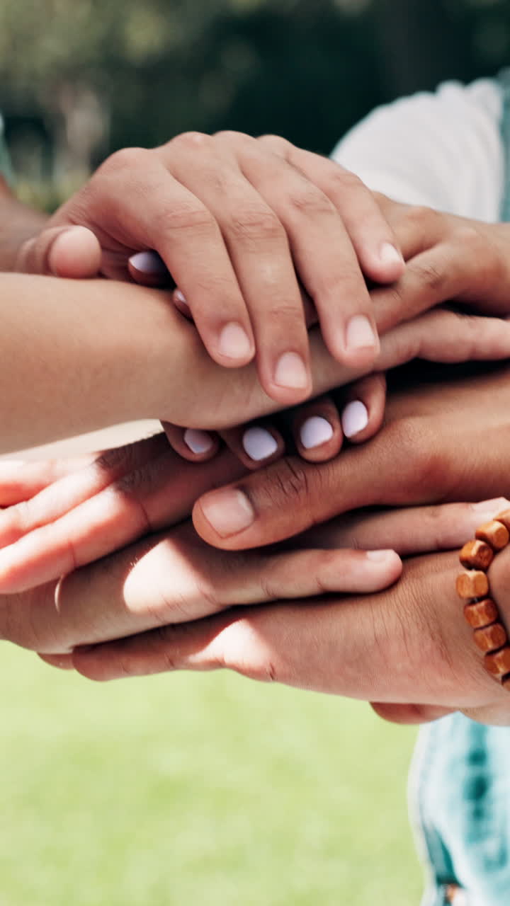 Close Up of Diverse Hands Stacking Together in Unity